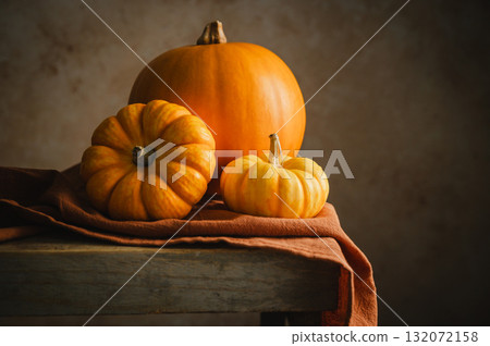 Orange pumpkins, rustic wooden moody background, autumn concept 132072158
