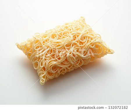 Creative display of uncooked instant noodles shaped like a pillow on a white background 132072182