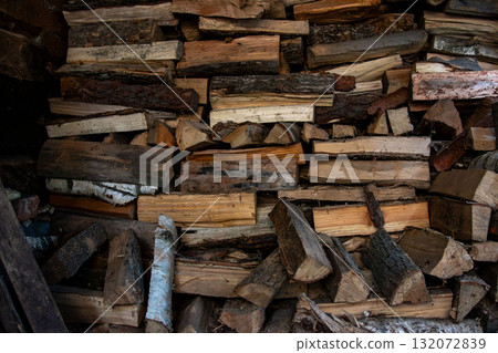 Large wood pile of chopped logs, natural wooden texture background 132072839