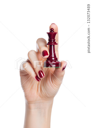 Hand holding single red chess queen piece, strategic game concept isolated on transparent background for decision making themes 132073489