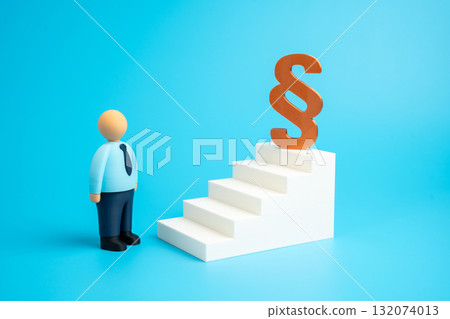 An office worker and a paragraph sign at the top of a staircase. Legal education. Ensuring one's rights are respected. Court and justice, fairness. Law, professional ethics, and social responsibility. An office worker and a paragraph sign at the top of a staircase. Legal education. Ensuring one's rights are respected. Court and justice, fairness. Law, professional ethics, and social responsibility. 132074013