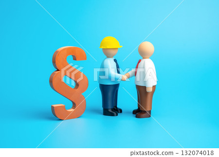 A construction worker and a government official shake hands against a paragraph symbol. Pre-trial conflict resolution. Regulation and the building code. Cooperation between business and government A construction worker and a government official shake hands against a paragraph symbol. Pre-trial conflict resolution. Regulation and the building code. Cooperation between business and government 132074018