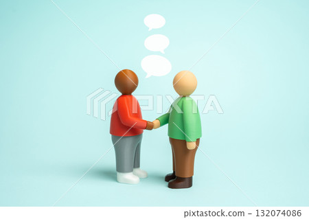 Two people shake hands and negotiate. Business. Communication and friendship. Partnership, contract signing, cooperation and trust in corporate relations. Teamwork, networking, leadership concepts. 132074086
