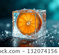 Fresh orange slice encased in ice cube with bubbles for a refreshing summer drink idea 132074156