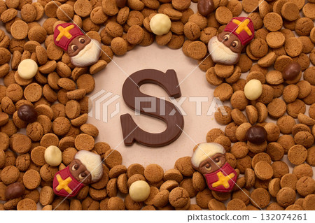 Dutch holiday Sinterklaas, St. Nicholas background with kruidnoten, pepernoten, traditional sweets 132074261
