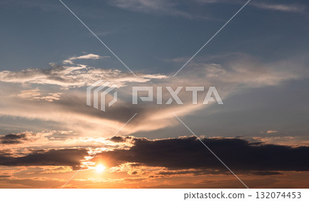 A serene sunset scene featuring a bright sun near the horizon, sky background A serene sunset scene featuring a bright sun near the horizon, sky background 132074453