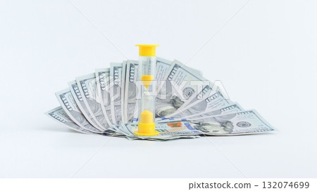 Time is Money Hourglass on a Pile of Hundred Dollar Bills, Financial Planning Concept Time is Money Hourglass on a Pile of Hundred Dollar Bills, Financial Planning Concept 132074699