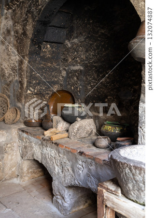 Dark stone kitchen, old style. 132074887