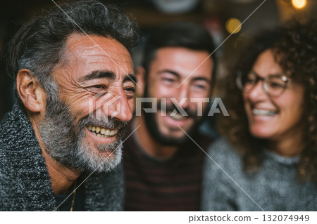 Group of friends laughing together in a cozy indoor setting 132074949