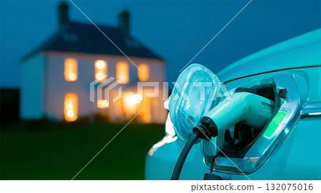 EV connects to charger in front of upscale home 132075016