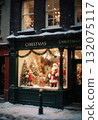 A beautiful scene of a shop window featuring Christmas decorations, including a Santa figure, trees, and presents, surrounded by a snowy street setting Generative AI 132075117