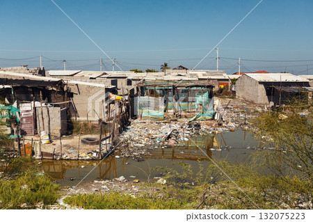 Unhygienic conditions and temporary homes in a slum on Isla del Rosario, Magdalena, Colombia. Unhygienic conditions and temporary homes in a slum on Isla del Rosario, Magdalena, Colombia. 132075223
