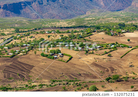 Scattered Ethiopian huts and farm plots in the highlands of the Southern Nations, Ethiopia. Scattered Ethiopian huts and farm plots in the highlands of the Southern Nations, Ethiopia. 132075231