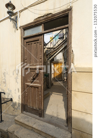 ancient decorated wooden door of a house in Baku, Azerbaijan 132075530