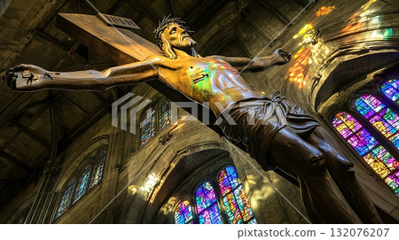 Wooden cross with a man on top of it 132076207