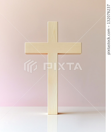 Wooden cross is standing upright on a white table Wooden cross is standing upright on a white table 132076237