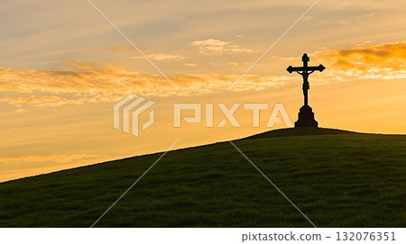Cross is on a hillside at sunset 132076351