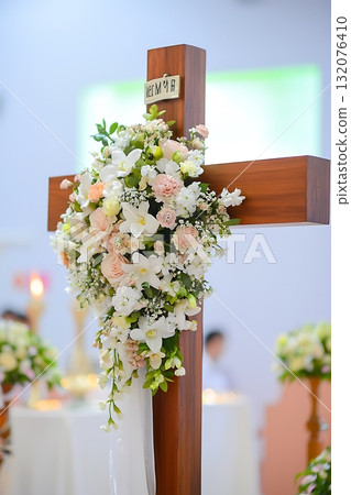Wooden cross is decorated with flowers and has the letters B and V on it Wooden cross is decorated with flowers and has the letters B and V on it 132076410