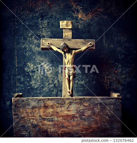 Wooden cross with a statue of Jesus Christ on top of it 132076462