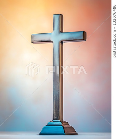 Silver cross is standing on a pedestal 132076486