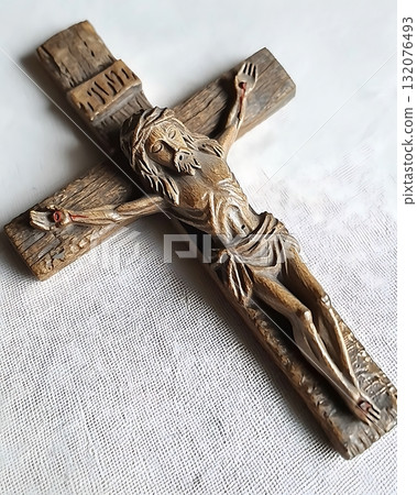 Wooden cross with a man on it 132076493