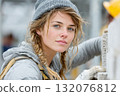 Young woman construction worker with tools and building materials on site 132076812