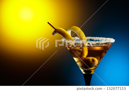 Glass of Martini with green olives and lemon peel. Glass of Martini with green olives and lemon peel. 132077153