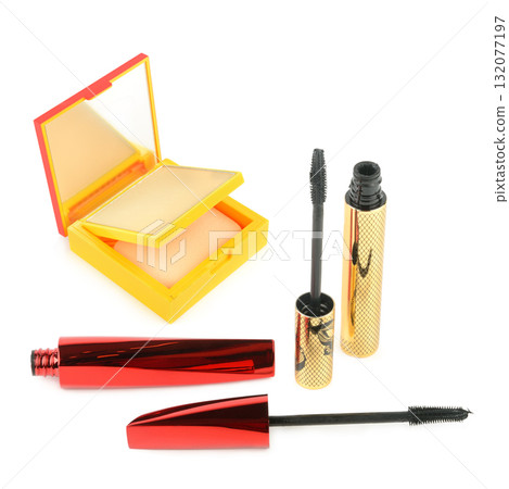 Assortment of Beauty Products: Compact Powder and Mascara on White 132077197
