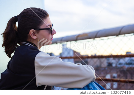Urban portrait of modern woman with buildings in blurred bacground.,great for contemporary brand campaigns Urban portrait of modern woman with buildings in blurred bacground.,great for contemporary brand campaigns 132077416