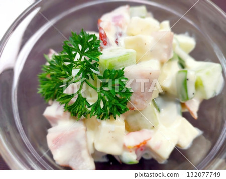 Fresh Salad With Parsley, Potatoes, Cheese, Meat, and Mayonnaise for a Delightful Meal 132077749