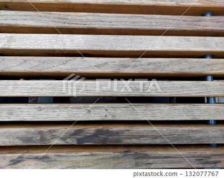 Wooden Strips Arranged on a Bench Surface in a Quiet Outdoor Setting During Daytime Wooden Strips Arranged on a Bench Surface in a Quiet Outdoor Setting During Daytime 132077767