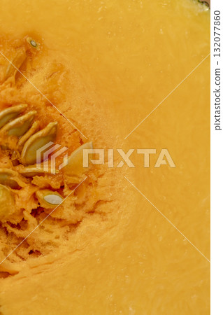 cut juicy yellow pumpkin for cooking, cut into pieces pumpkin in the kitchen cut juicy yellow pumpkin for cooking, cut into pieces pumpkin in the kitchen 132077860
