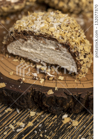 cut marshmallows in chocolate sprinkled with waffle crumbs, sweet dessert marshmallows in milk chocolate with crumbs cut in half cut marshmallows in chocolate sprinkled with waffle crumbs, sweet dessert marshmallows in milk chocolate with crumbs cut in half 132077870