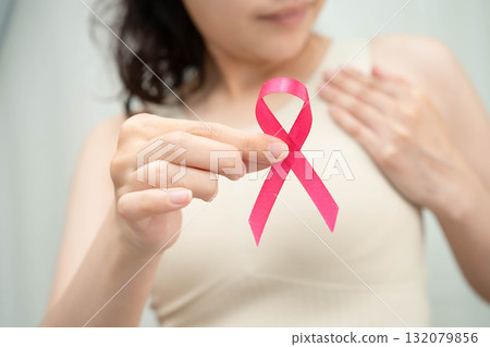 Asian woman with pink ribbon for October world breast cancer day. 132079856