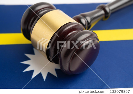 Nauru law, Legal, justice and agreement, wooden court gavel on flag. 132079897