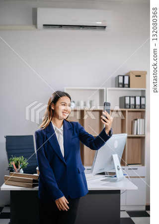 Confident business expert attractive smiling young woman holding digital tablet on desk Confident business expert attractive smiling young woman holding digital tablet on desk 132080368