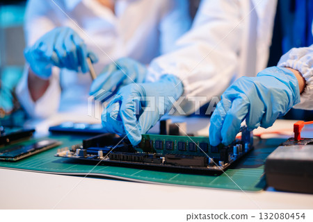 Electronics assembly and RAM installation with high-tech components. Ideal for showcasing advanced technology Electronics assembly and RAM installation with high-tech components. Ideal for showcasing advanced technology 132080454