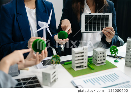 Business people having consultation about wind energy at company office. Business team discussing about windmill and alternative green energy. 132080490