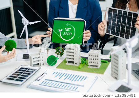 Business team people planning hand using laptop for working technology and business Net zero and carbon neutral concept.NET ZERO icons Business team people planning hand using laptop for working technology and business Net zero and carbon neutral concept.NET ZERO icons 132080491