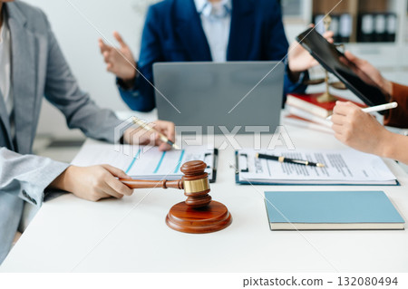 business people and lawyers discussing contract papers sitting at the table. Concepts of law, advice, legal services. 132080494