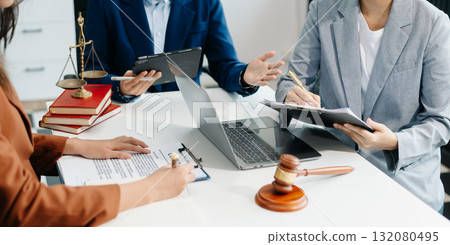 business people and lawyers discussing contract papers sitting at the table. Concepts of law, advice, legal services. business people and lawyers discussing contract papers sitting at the table. Concepts of law, advice, legal services. 132080495