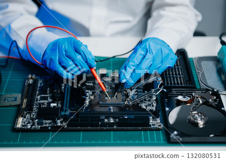 Electronics technician, electronic engineering electronic repair, electronics measuring and testing, repair and maintenance concepts.uses a voltage meter Electronics technician, electronic engineering electronic repair, electronics measuring and testing, repair and maintenance concepts.uses a voltage meter 132080531