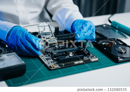 Electronics technician, electronic engineering electronic repair, electronics measuring and testing, repair and maintenance concepts.uses a voltage meter 132080535