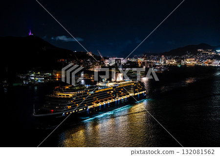 Departing Nagasaki Port with the Westerdam cruise ship. Night view illuminated from Megami Bridge [Nagasaki City] 132081562