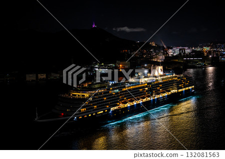 Departing Nagasaki Port with the Westerdam cruise ship. Night view illuminated from Megami Bridge [Nagasaki City] 132081563