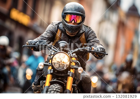 Motorcyclist riding custom scrambler motorcycle in city traffic Motorcyclist riding custom scrambler motorcycle in city traffic 132081929