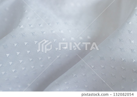Soft waved fabric texture in white tones with shiny silk design for creative design. Soft waved fabric texture in white tones with shiny silk design for creative design. 132082054
