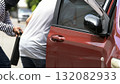 thief stealing a briefcase from a man near a red car, representing street crime, danger, and theft in urban areas. Concept of robbery, loss prevention, and personal safety awareness in public 132082933