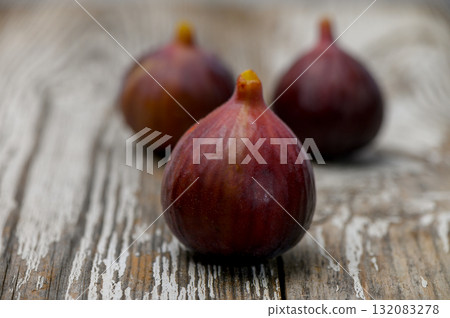 Juicy Ripe Fig from Cyprus on Wooden Table Juicy Ripe Fig from Cyprus on Wooden Table 132083278