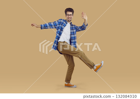 Young bearded man is dancing, having fun and fooling around. Young bearded man is dancing, having fun and fooling around. 132084310